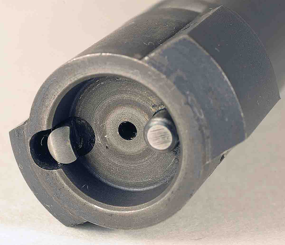 The Pro-Series 2000 receiver features a recessed bolt face with a solid rim. The extractor is the hook (left side) on the bolt face. The plunger ejector is on the opposite side.